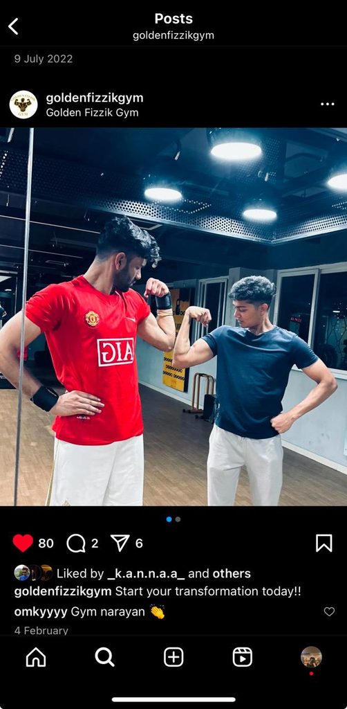Prem flexing with a friend at Golden Fizzik Gym
